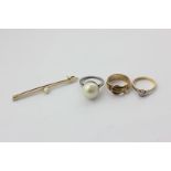 An old cut diamond single stone ring in 18ct gold, a 9ct gold buckle ring, an imitation pearl