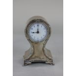 An Edward VII small silver cased mantel clock, white enamel circular dial, in balloon shaped case