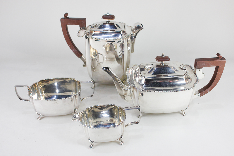 A silver plated four-piece tea set, rectangular form with beaded borders, on cabriole feet, to