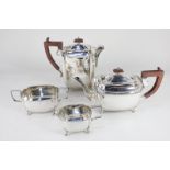 A silver plated four-piece tea set, rectangular form with beaded borders, on cabriole feet, to