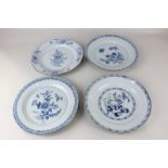 Four Chinese porcelain blue and white plates, all with floral designs