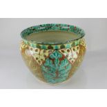 A Della Robbia pottery jardiniere of floral scrolling design, 29cm diameter, (a/f - significantly