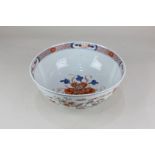 A Chinese porcelain bowl, circular shape on pedestal foot, with central flowers and lozenge