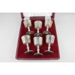 A cased set of six modern silver goblets with gilt interior bowls on baluster supports, maker