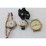 A lady's 9ct gold bracelet watch, another on fabric strap, and a 9ct gold Rotary wristwatch (a/f)