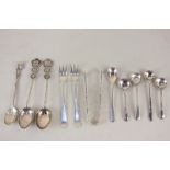 A collection of silver and silver plated cruet spoons including a pair of Edward VII silver pickle