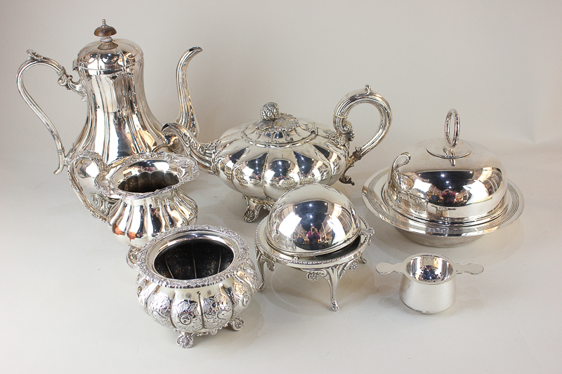 A Mappin & Webb silver plated muffin dish, a James Dixon & Sons coffee pot, a revolving butter dish,