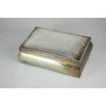 A George V silver cigar box, rectangular form with curved sides and top, with beaded border, wood