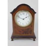 An inlaid mahogany mantel clock with white enamel dial, Arabic numerals, movement stamped Buren,