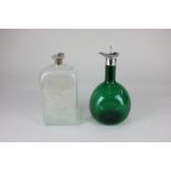 An Edwardian silver mounted green glass bottle, maker J & J Maxfield Ltd, Birmingham 1904, with