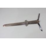 A Victorian silver letter opener with Gothic style handle with two retractable knife blades,