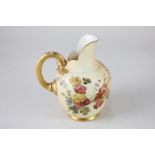 A Royal Worcester porcelain jug depicting a floral spray on ivory blush ground