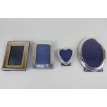A George V silver photograph frame for picture 9.5cm by 6cm, a modern silver heart-shaped photograph