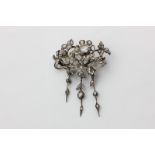 A 19th century diamond brooch of foliate design set throughout with graduated rose cuts