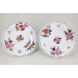 A pair of Worcester Flight Barr & Barr porcelain dessert plates decorated with floral sprays in