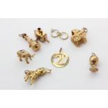 Eight gold charms, mixed carats, 45.5g