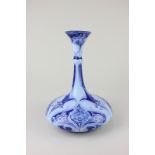 An Art Nouveau Moorcroft Florian Ware pottery vase, the floral pattern on shades of blue ground, the