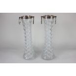 A pair of Continental white metal mounted (possibly French silver) cut glass vases with embossed