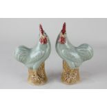 A pair of Chinese pottery cockerel, seal marks to base, 18cm high