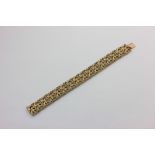 A 9ct gold leaf scroll link bracelet, 34.7g