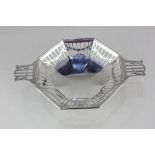 A George V silver pierced dish, octagonal form with two handles and pierced swag decoration, on