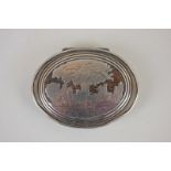A 19th century Continental white metal mounted oval trinket box depicting a figure in a tree with