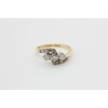A diamond crossover ring, the three centre stones with diamond shoulders, in platinum on 18ct gold