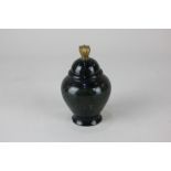 A spinach jade brush pot with brass finial, 10cm high