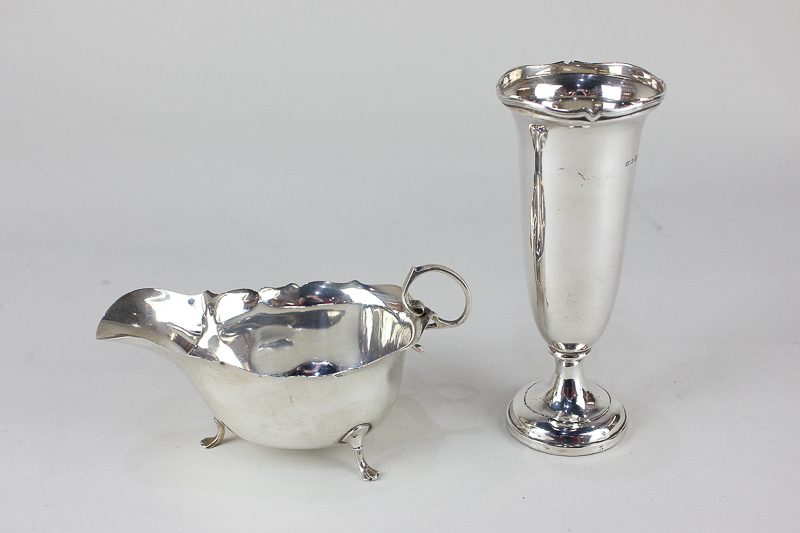 A George V silver sauce boat, maker James Deakin & Sons, Sheffield 1920, together with a silver