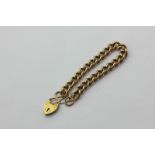 A 9ct gold curb link bracelet with padlock clasp, 33.6g