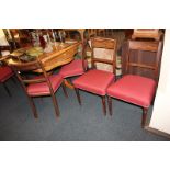 A set of six 19th century bar back dining chairs, with red upholstered seats, on tapered turned