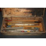 A collection of croquet equipment containing two Slazenger mallets and five others, nine balls,