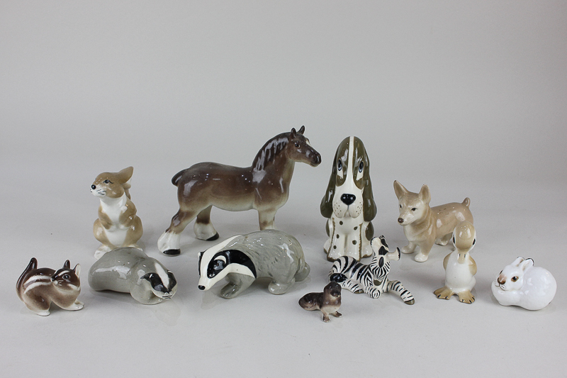 A collection of USSR Lomonosov and Szeiler porcelain models of animals including a horse, a zebra,