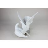 A Lladro porcelain figure group of two doves, Love Nest, in original box, 23.5cm high, together with