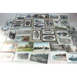 A scrap album containing early 20th century black and white and coloured postcards from Australia,