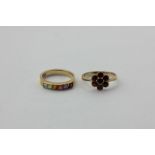 A garnet ring in 9ct gold, and a six-stone varicoloured gem set half hoop ring