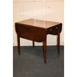 A 19th century mahogany Pembroke table with drawer with brass knob handles, on square tapered legs