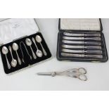 A George V cased silver set of six coffee spoons and sugar tongs, Sheffield 1932, a cased set of six