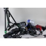 A collection of cameras and accessories including tripods and a lens, to include a Pentax P30 and