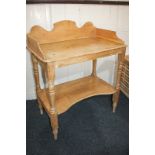 A pine washstand with shaped raised back and sides, on turned legs with undershelf, 81cm