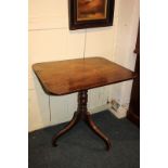 A 19th century tilt-top table with rectangular shaped top, on tripod legs with scroll feet, 76cm, (