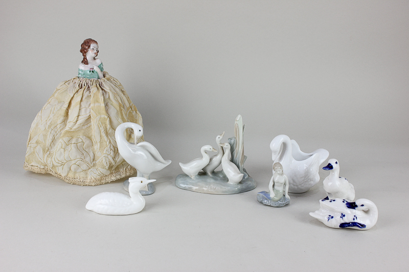 A Lladro porcelain model of a goose, 11cm, together with a Nao model of three geese, 12cm, a