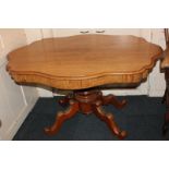 A Victorian oval shaped pedestal table, on outswept legs to scroll feet, 136cm