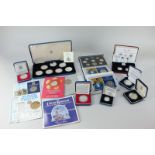 A collection of cased Royal Mint silver proof coins and coin sets, including Queen Mother 80th
