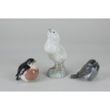 Three Royal Copenhagen porcelain models of birds, to include a large yellow chick, 14.5cm, and a