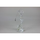 A Baccarat clear glass figure of a golfer holding a metal club in back swing, 20.5cm