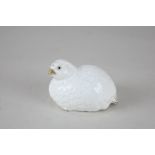An Aynsley porcelain pepper pot in the form of a baby game bird, white glazed with gilt