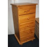 A pine narrow chest of five drawers with knob handles, on turned feet, 46cm