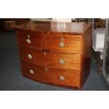 A mahogany bow-front chest of two short over two long drawers with later pierced gilt metal handles,