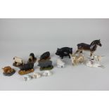 Six Szeiler porcelain models of animals, a pig, a corgi, three sleeping dogs, and a stylised lamb, a